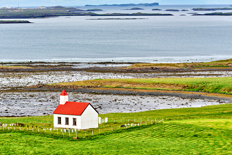 Church stands in western fjords of Iceland near the sea  Print