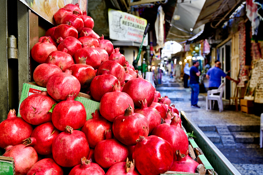 Fresh fruit stall in old city of Jerusalem with red pomegranates  Print