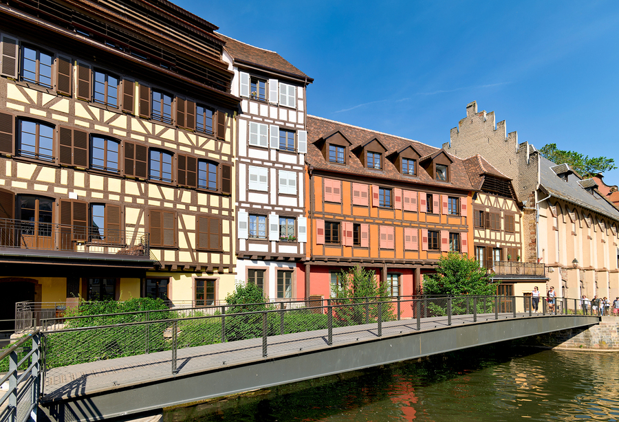 Visitors enjoy Petit France in Strasbourg with timber framed hou  Print