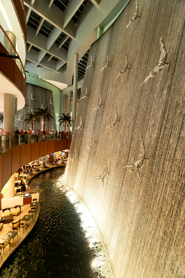Indoor waterfall with diving sculptures and dining in Dubai UAE  Print
