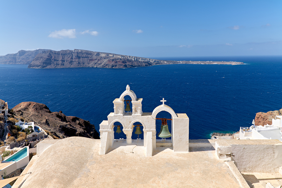 Iconic Santorini bell tower overlooking the caldera and Aegean S  Print