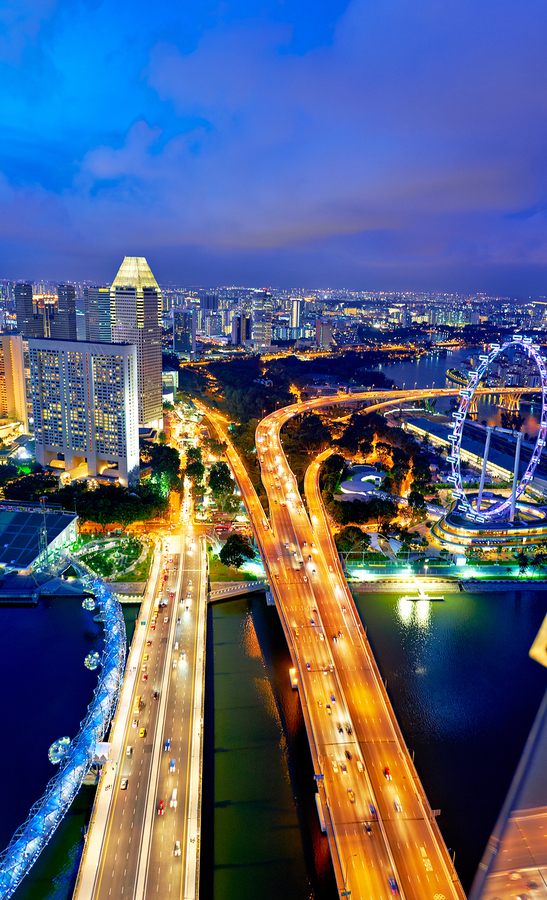 City lights shine in Marina Bay as sunset brings night activity  Print