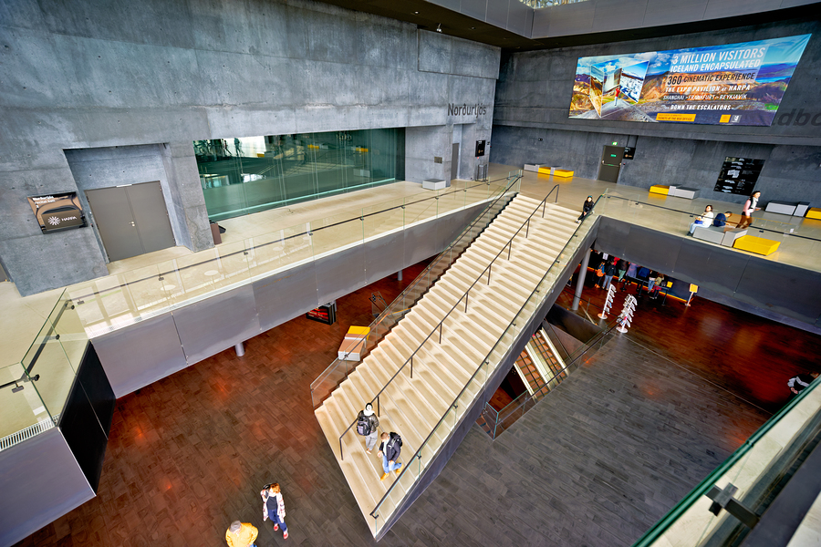 Harpa opera house interior featuring stairs and visitors  Print