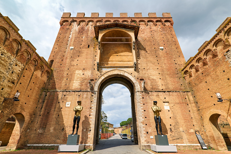 Porta Romana gate in Siena Tuscany Italy shows history and art  Print