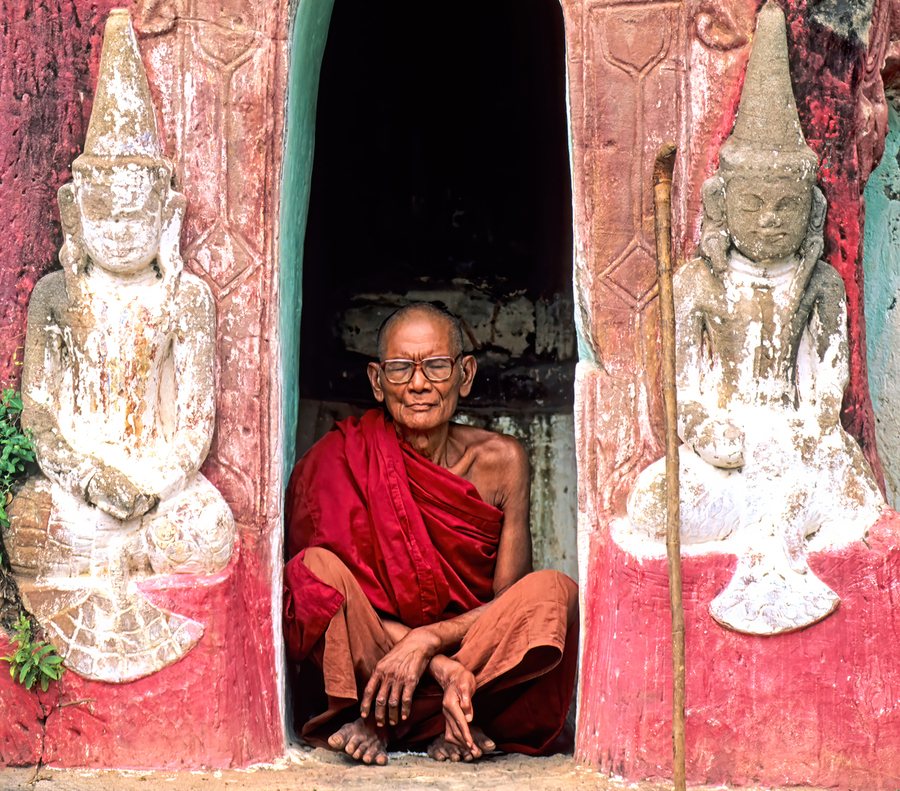 Old monk meditates in temple doorway in Myanmar  Print