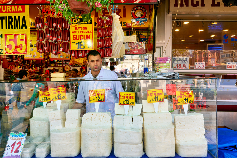 Cheese vendor at Grand Bazaar in Istanbul during busy hours  Print