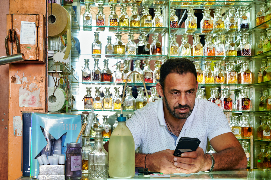 Man working in a perfumery in the old city of Jerusalem  Print