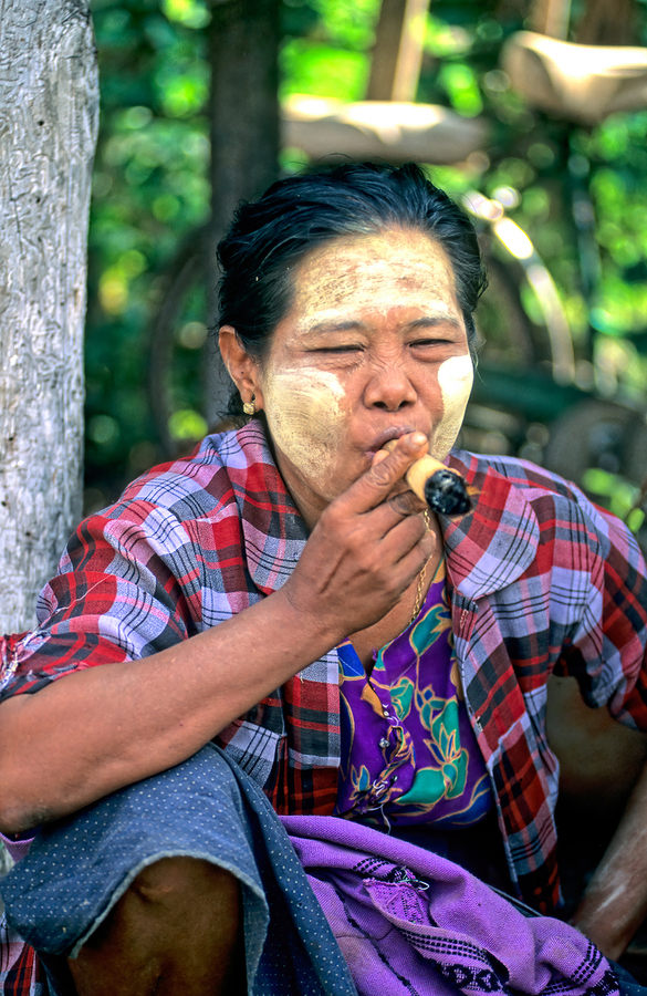 Portrait of a woman smoking in Myanmar during a sunny day  Print
