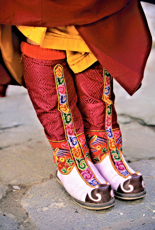 Colorful embroidered traditional boots and robes.  Print