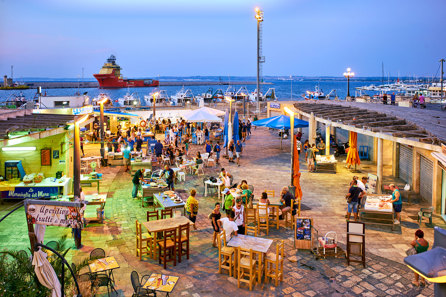 Salento. Apulia Puglia Italy. Gallipoli. Fish restaurants at the harbour  Print