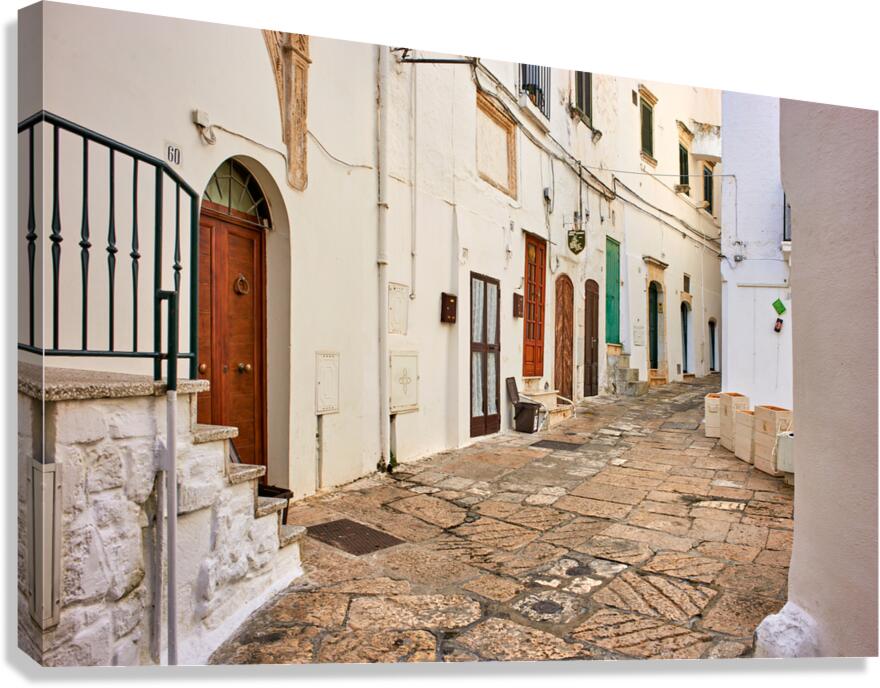 Apulia Puglia Italy. Ostuni. The white town. The narrow alleys of the old town Canvas Print