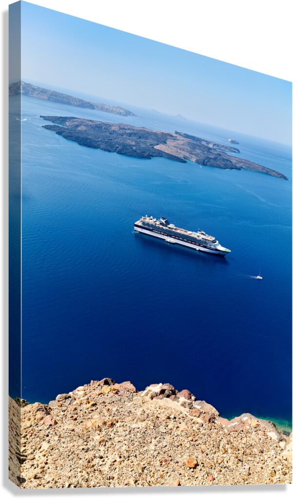 Cruise ship in deep blue sea volcanic islands rocky foreground Canvas Print