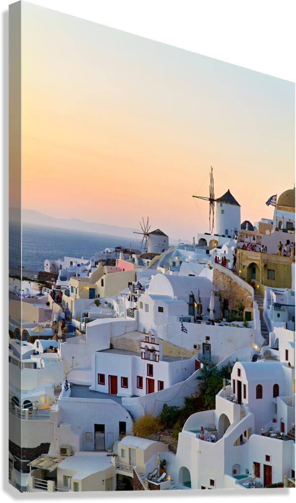 Oia Santorini: White buildings windmills and sunset over the  Canvas Print