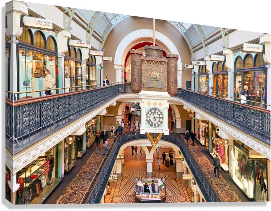 Elegant Victorian shopping arcade with clock tower and shoppers. Canvas Print