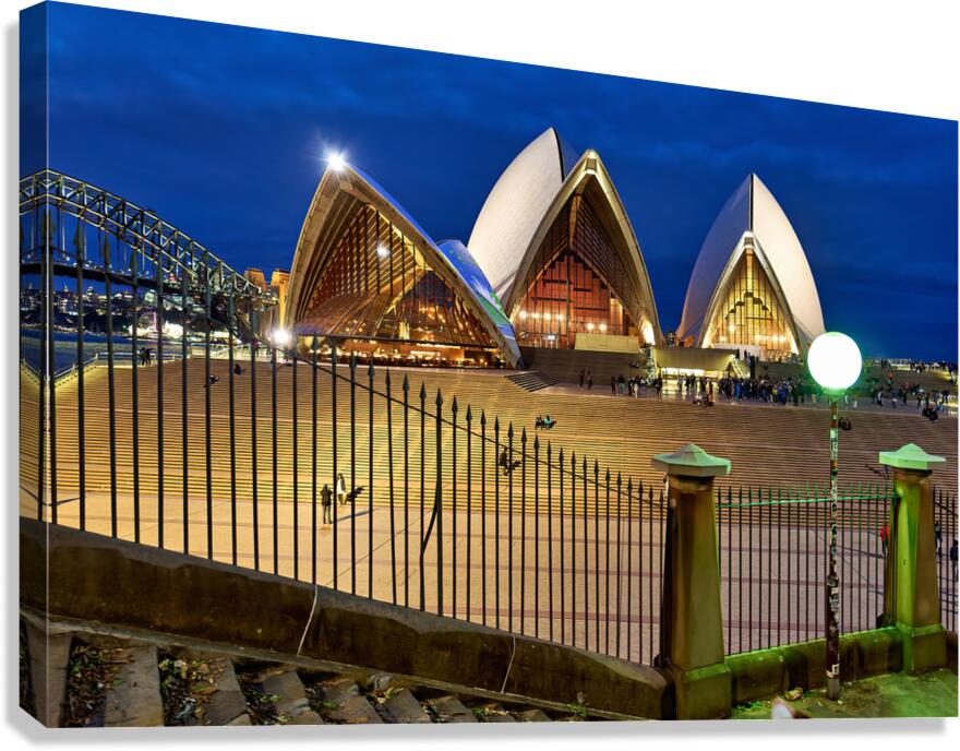 Sydney Opera House illuminated at dusk with crowds on steps. Canvas Print