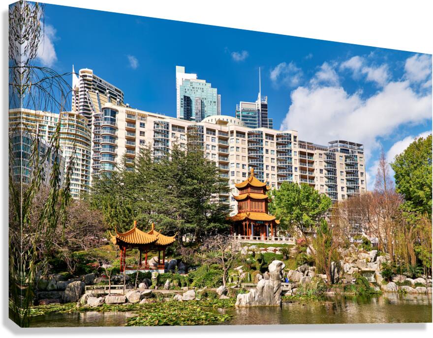 Chinese garden with pagodas and modern buildings Canvas Print