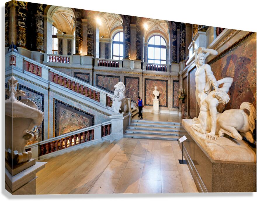 Ornate museum hall with statues grand staircase and visitor. Canvas Print