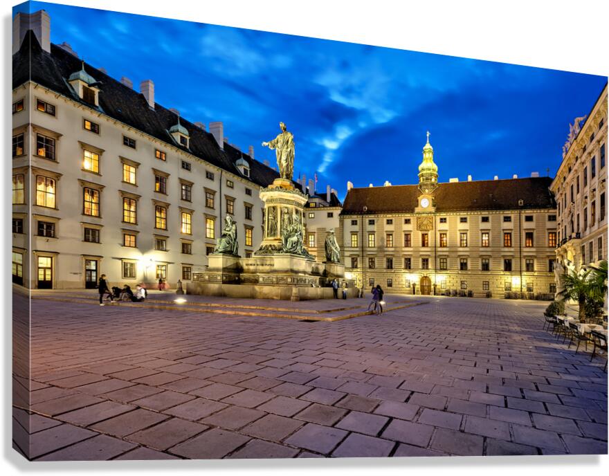 Hofburg Palace square at night with illuminated buildings and st Canvas Print