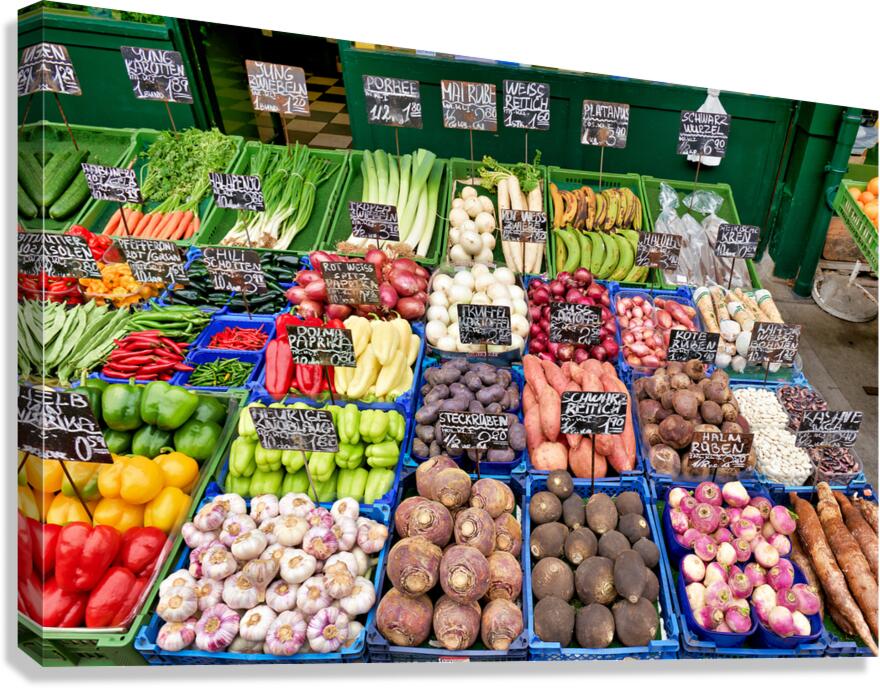 Colorful fresh vegetables and fruits displayed at a market stall Canvas Print