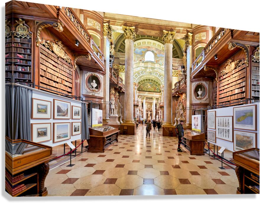 Grand ornate library interior with books columns and visitors Canvas Print