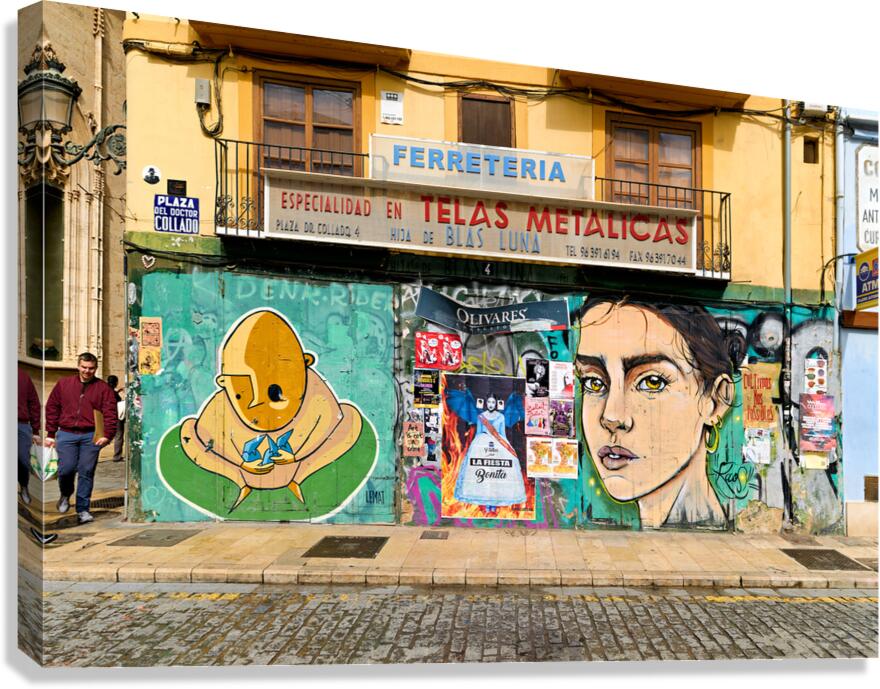 Valencia street art features murals and colorful buildings in Sp Canvas Print