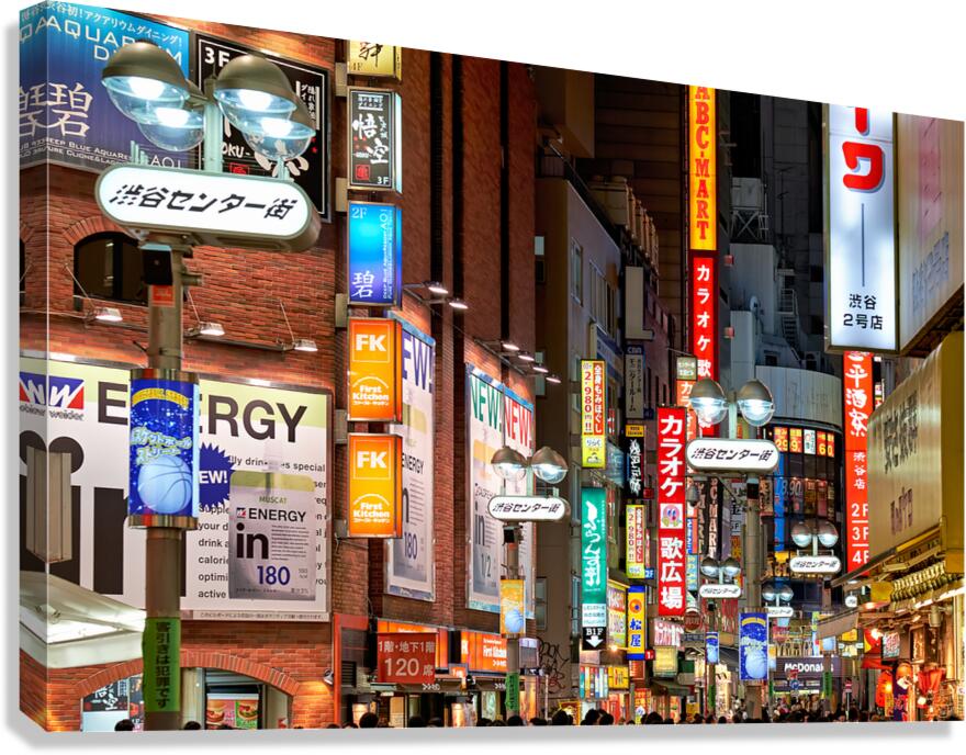Neon lights shine bright in Shibuya district at night in Tokyo Canvas Print