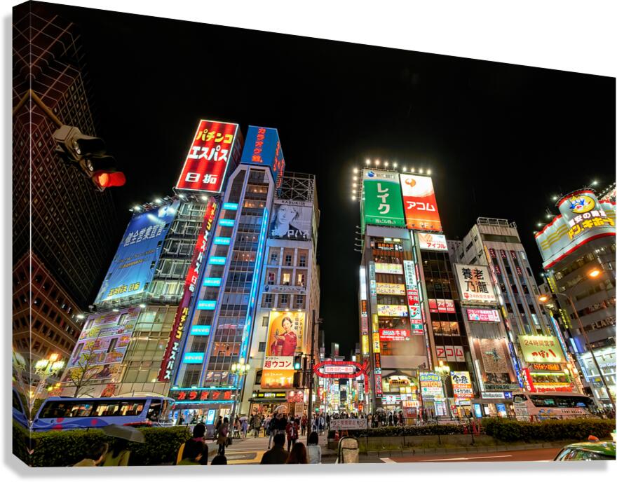 Neon lights shine bright in Shinjuku district of Tokyo at night Canvas Print