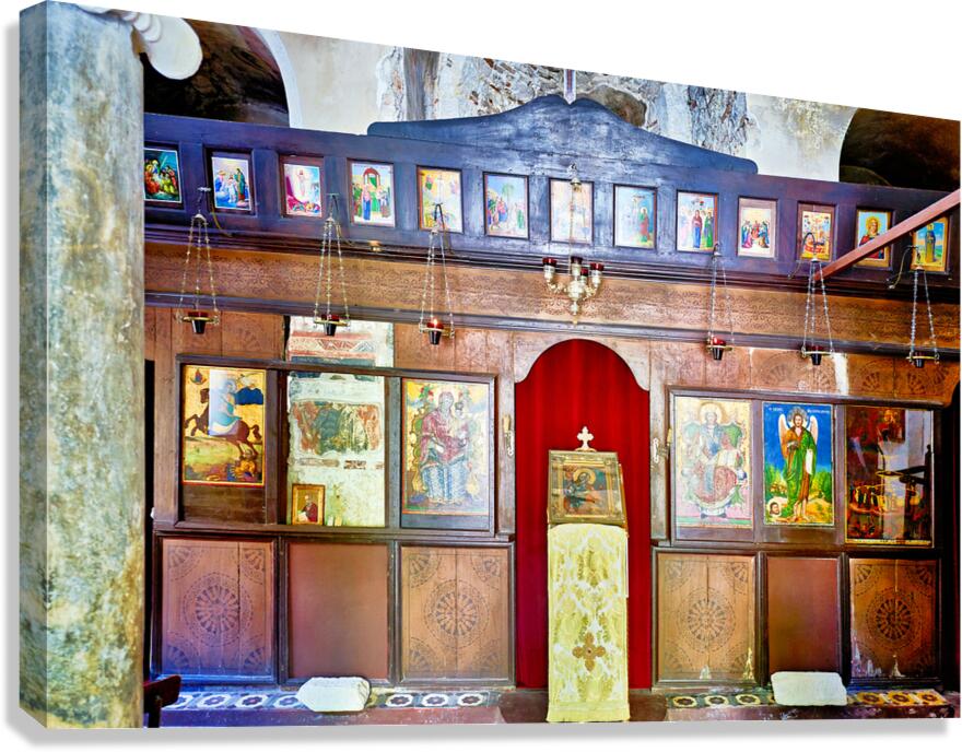 Old church interior with icons and altar in quiet setting Canvas Print