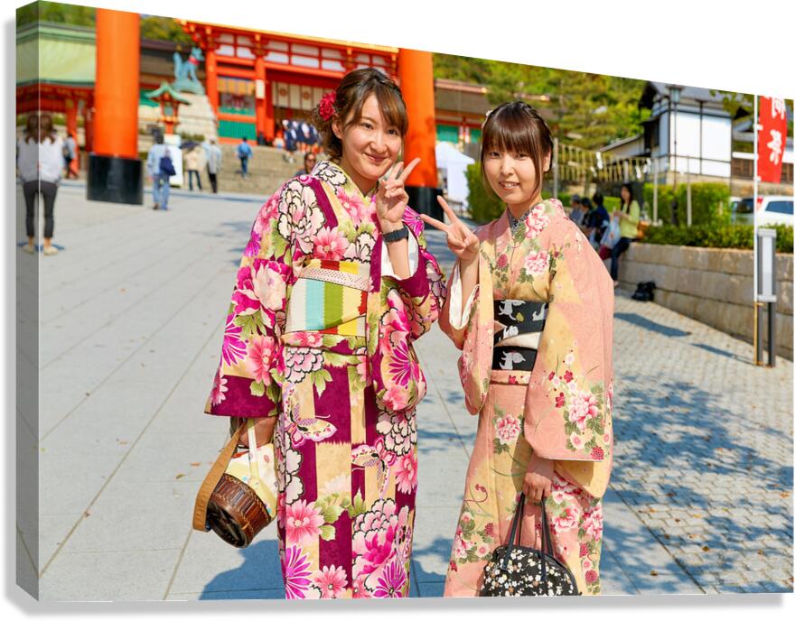 Young women enjoy Fushimi Inari Taisha Shrine in Kyoto Japan Canvas Print
