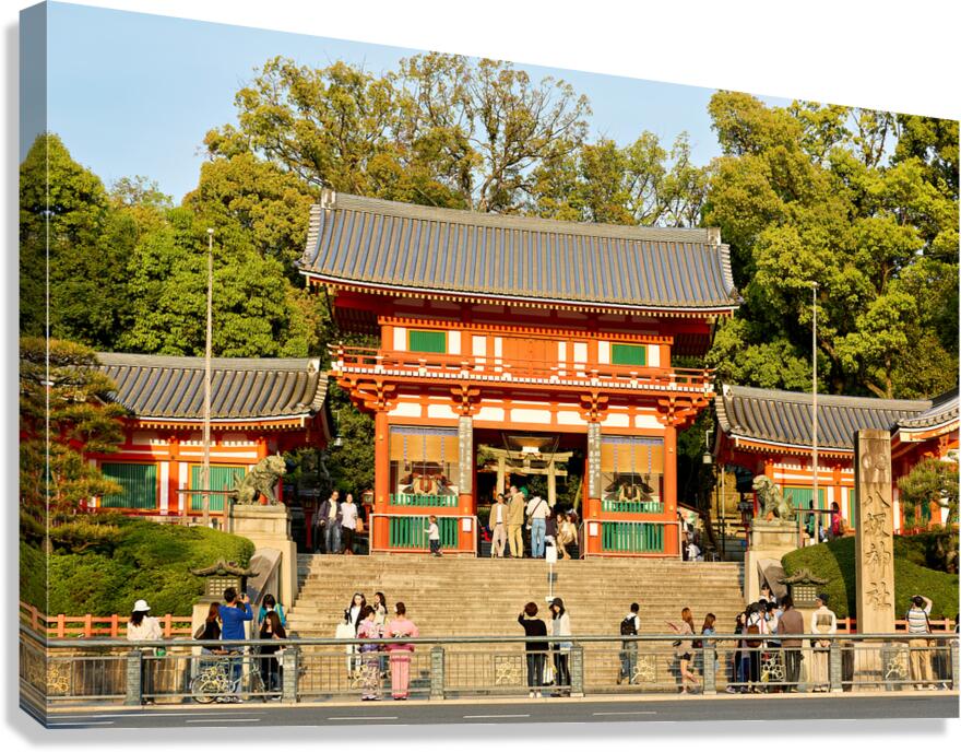 Kyoto Yasaka shrine temple with visitors and trees in background Canvas Print