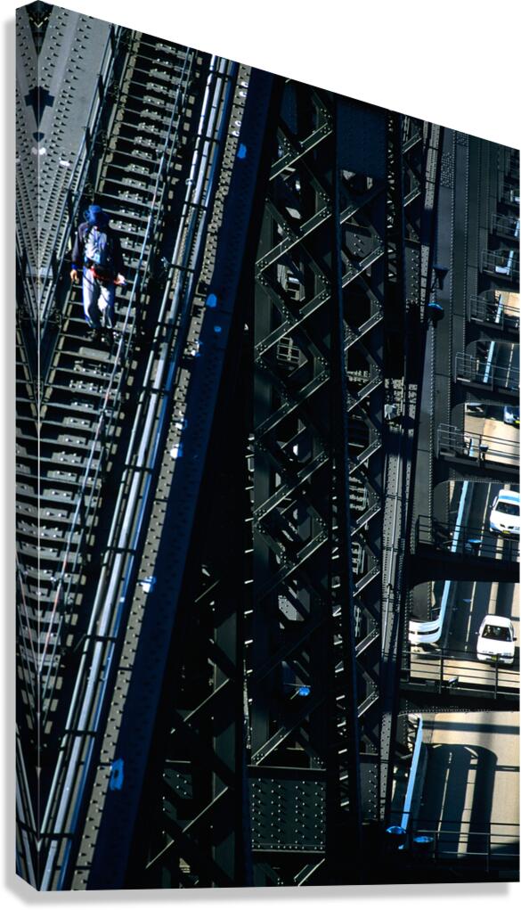 Man walks on bridge with cars below Canvas Print