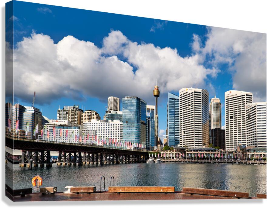Sydney Harbour skyline with bridge and buildings under clouds. Canvas Print