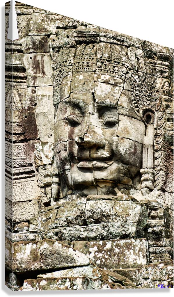 Serene stone face carving Bayon temple Angkor. Canvas Print
