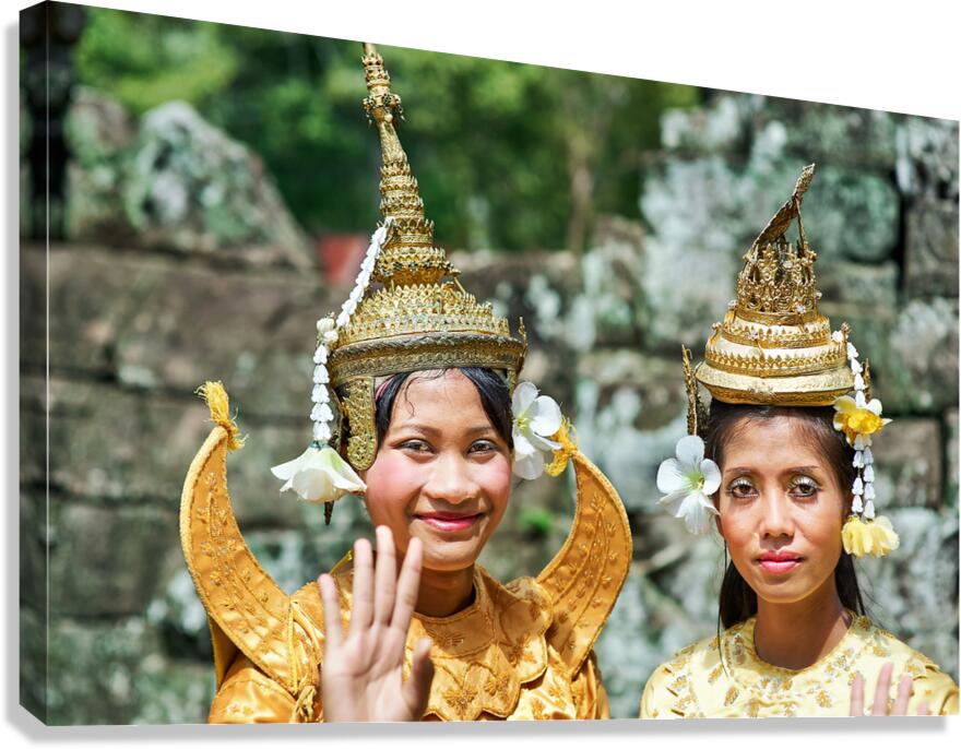 Cambodian dancers in golden attire and elaborate headwear. Canvas Print