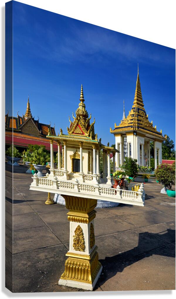 Golden shrine and temple buildings in Cambodia under blue sky. Canvas Print