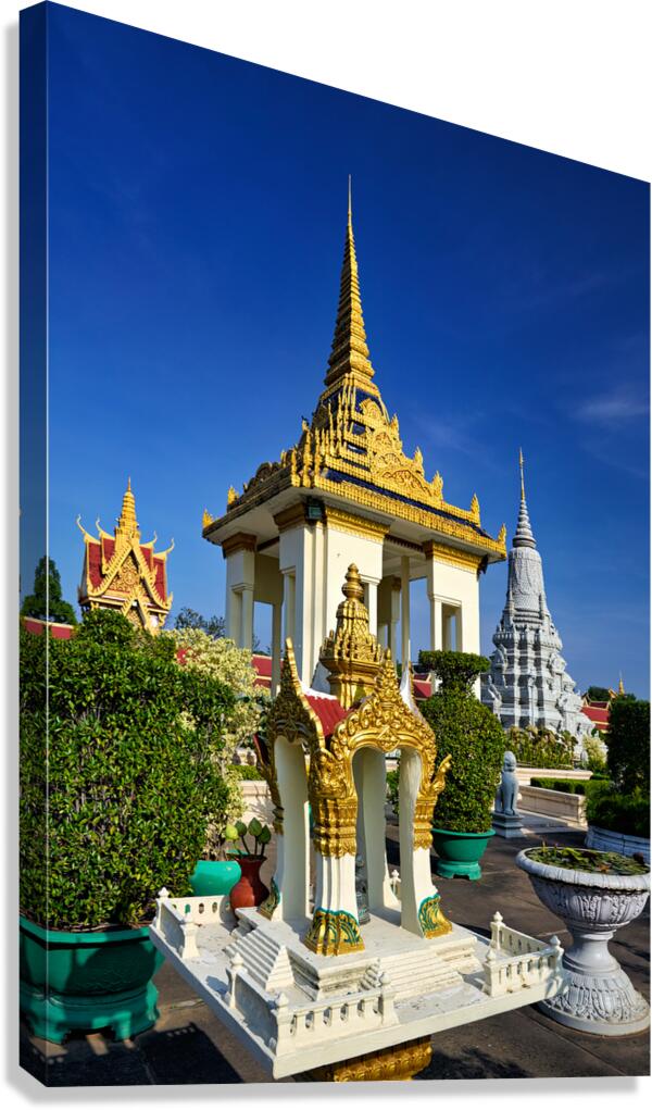 Golden temples and a grey stupa under a clear blue sky. Canvas Print