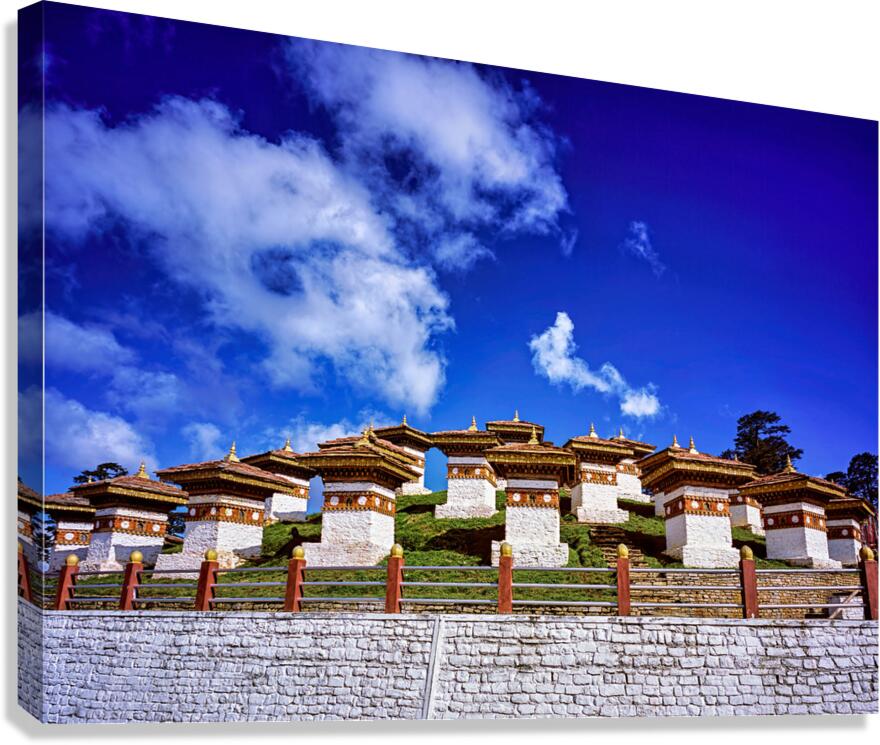 Traditional Bhutanese chortens on a green hill blue sky. Canvas Print