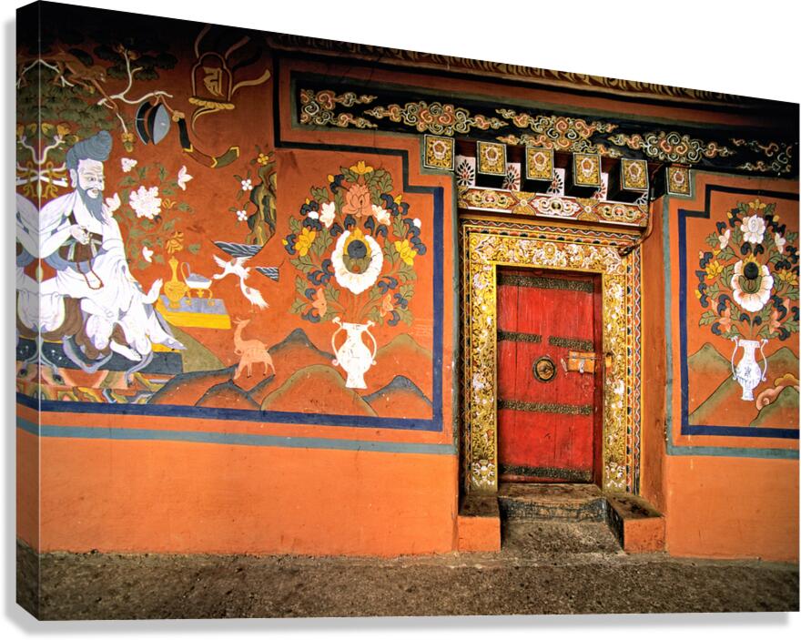Vibrant wall murals and an ornate red door. Canvas Print