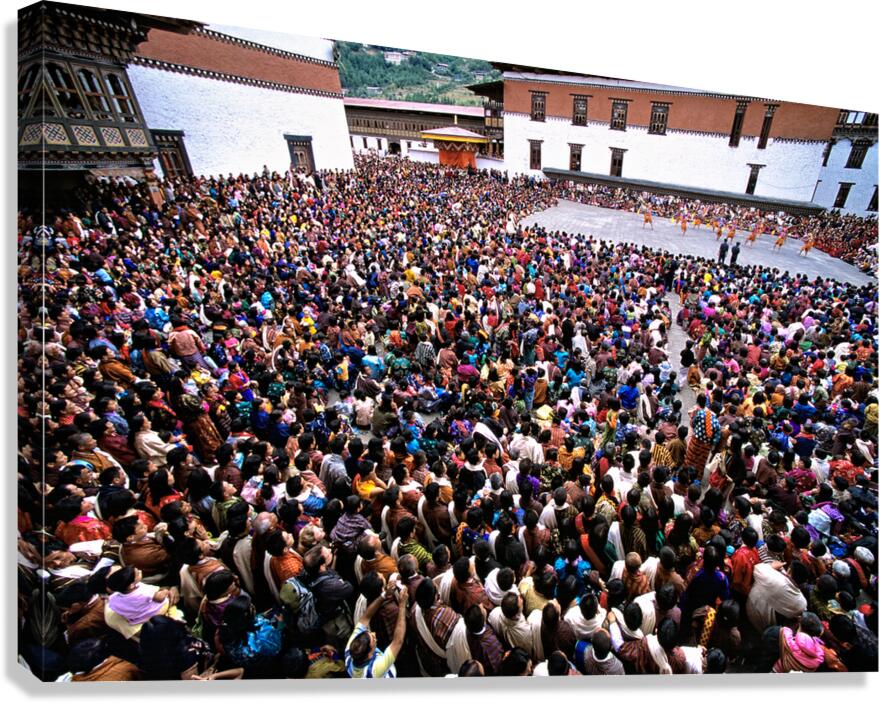 Bhutanese festival: crowd watches traditional dance in monastery Canvas Print