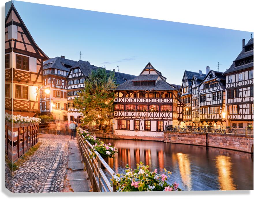 Evening in Petit France with timber framed houses by water Canvas Print
