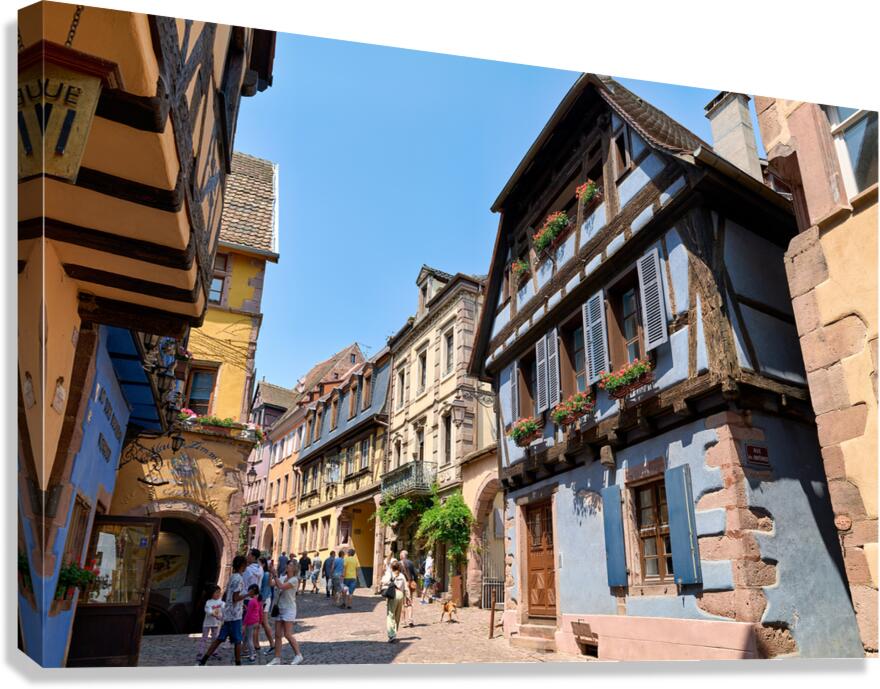 Visitors discover timber houses in Riquewihr Alsace Canvas Print