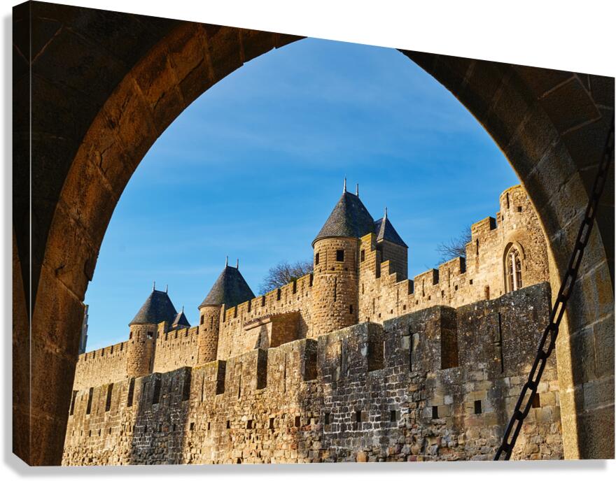 Exploring the historic walls of Carcassonne in France under blue Canvas Print