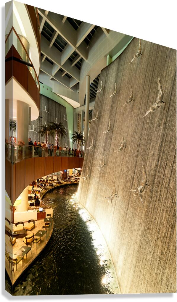 Indoor waterfall with diving sculptures and dining in Dubai UAE Canvas Print