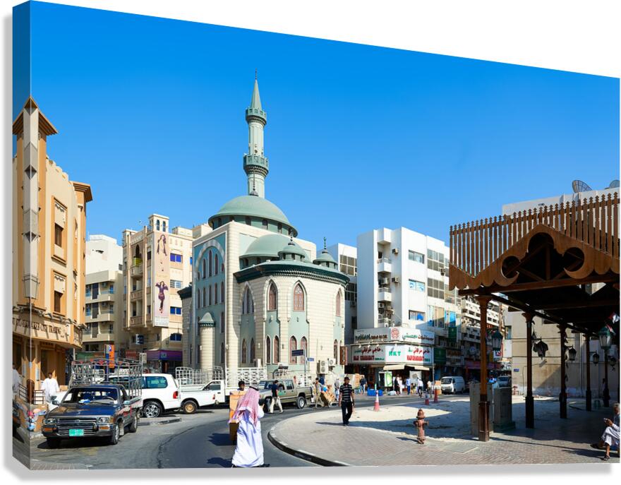 Middle Eastern street scene with mosque and market in Dubai UAE Canvas Print