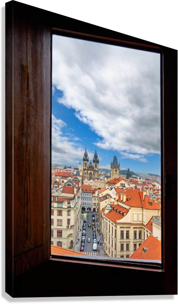 Prague cityscape from window Tyn Church red roofs. Canvas Print