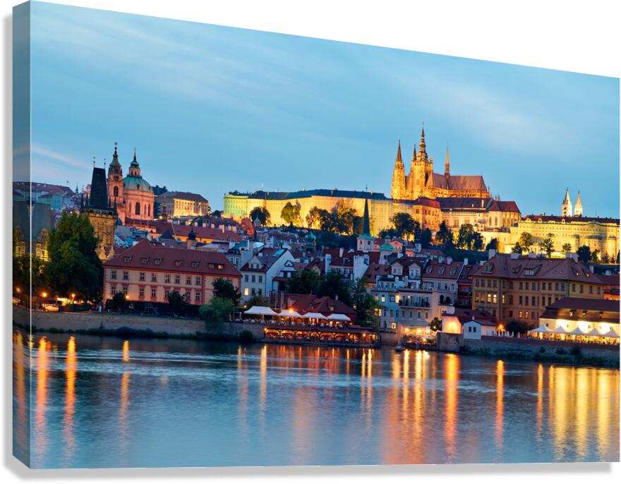 Prague cityscape at night with castle and river reflections. Canvas Print