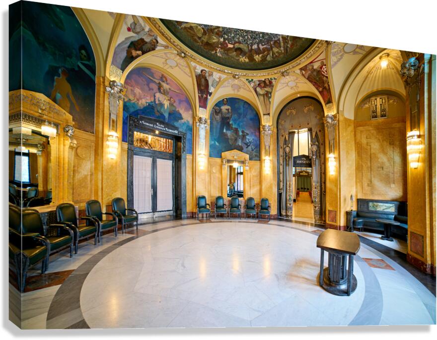 Ornate historic hall with murals arches and elegant seating. Canvas Print