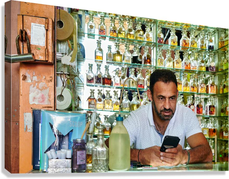 Man working in a perfumery in the old city of Jerusalem Canvas Print