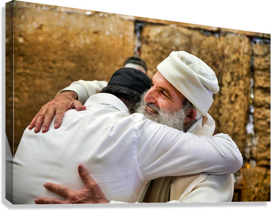 Men embrace each other at the Wailing Wall in Jerusalem Canvas Print