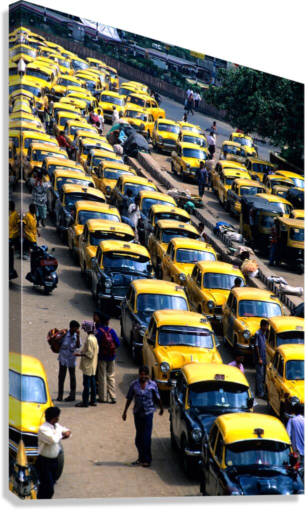 Taxi parking in Kolkatas busy streets during daytime Canvas Print